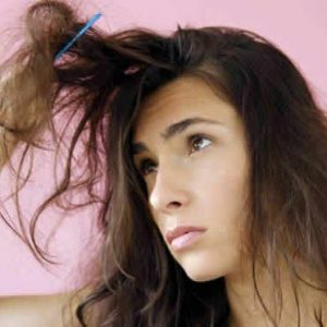 Young Woman Looking At Her Bed Head Tangled Hair