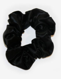 Black Colored Silk Scrunchie Displayed On A White Background
