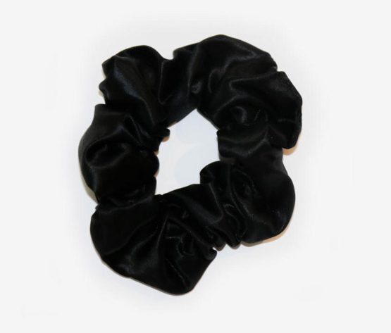 Black Colored Silk Scrunchie Displayed On A White Background