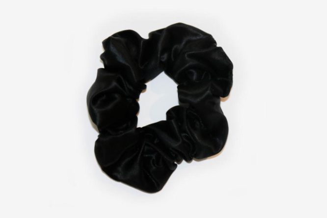 Black Colored Silk Scrunchie Displayed On A White Background
