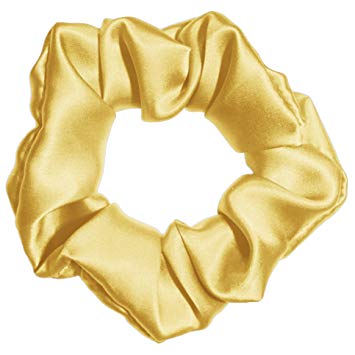 Gold Colored Silk Scrunchie Displayed On A White Background